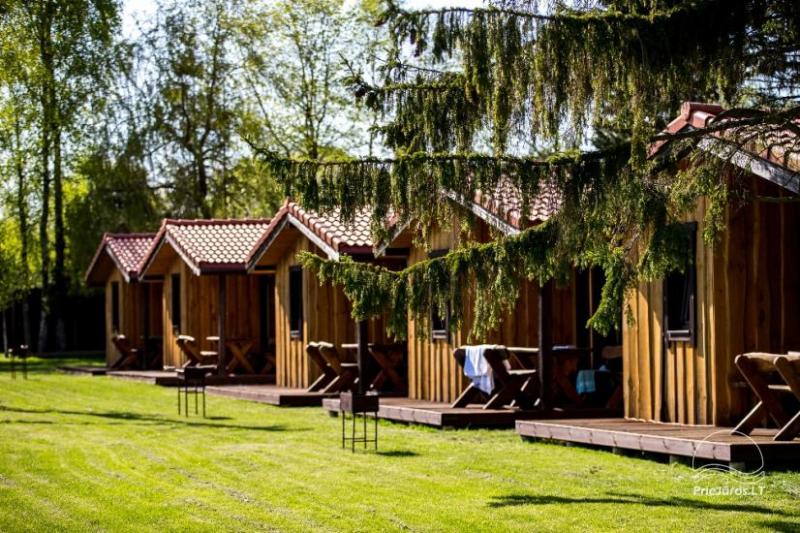 Fetingas - wooden houses and guest house on the river bank