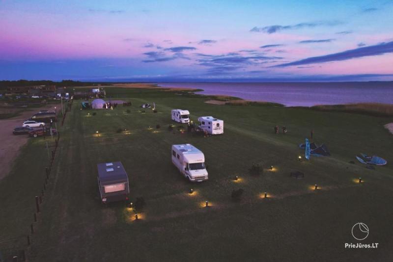 Fenas Kite Spot camping on the shore of the lagoom, in Lithuania, in Svencele
