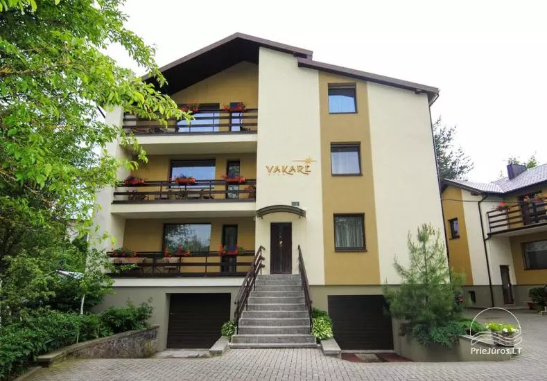 Accommodation in Palanga villa Vakare. In the yard: summerhouses with outdoor furniture