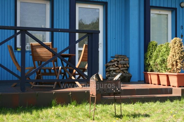 Three-bedroom cottage in Pervalka with fireplace and sauna